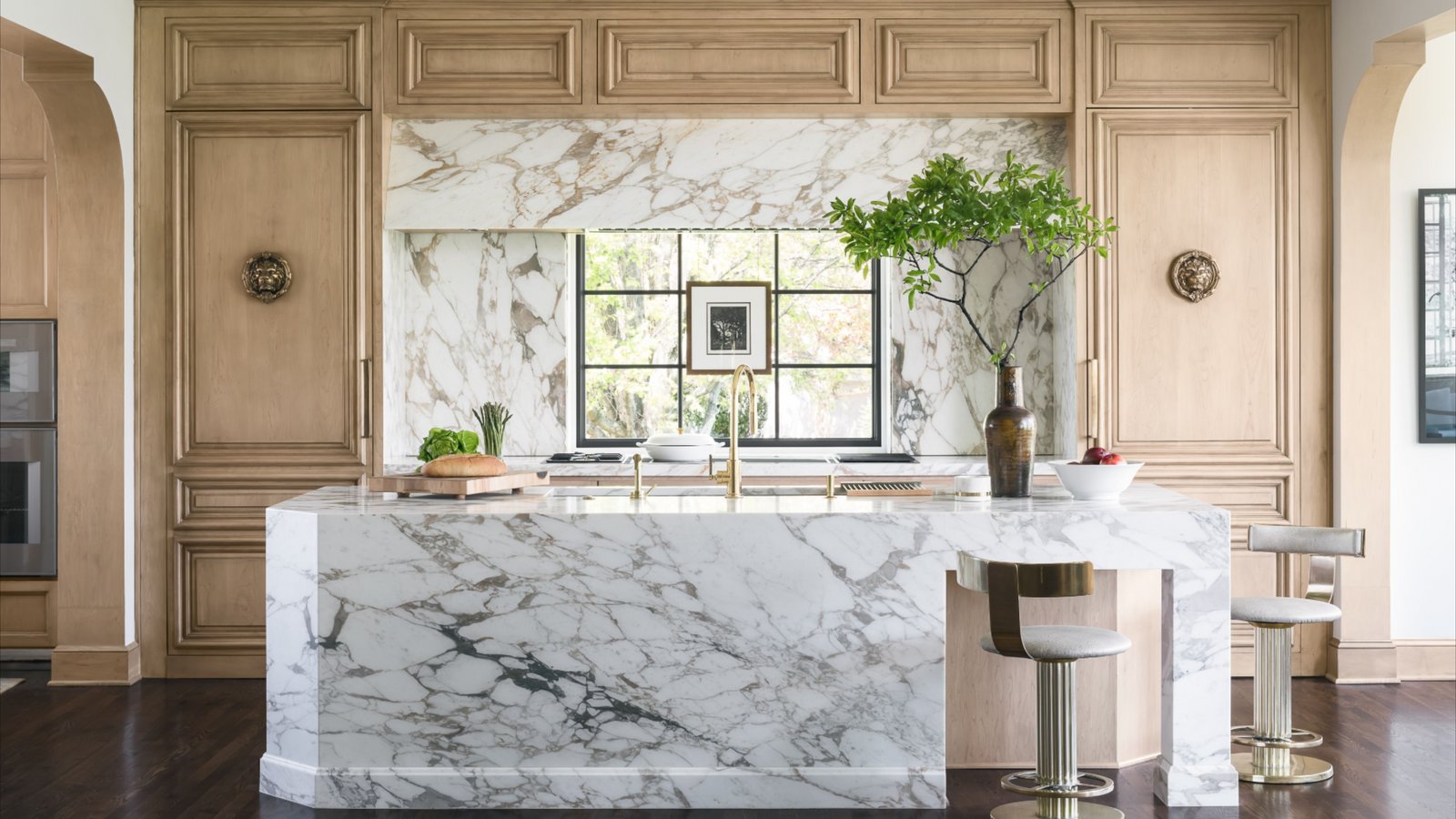 Luxury kitchen with marble island and custom wood cabinetry